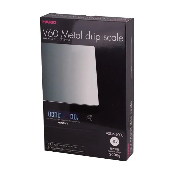 Comandante black coffee grinder with Hario V60 metal drip scale for precise brewing and measurement.