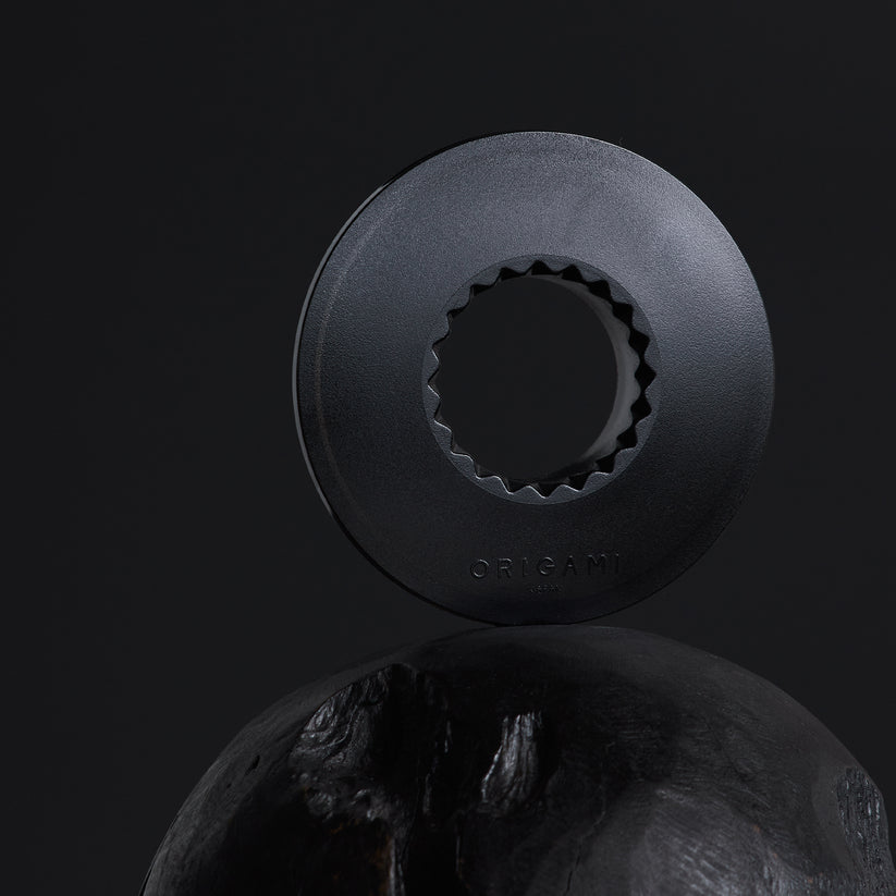 Clear holder for Origami coffee grinder by Comandante, designed to securely store and protect the grinder during use.