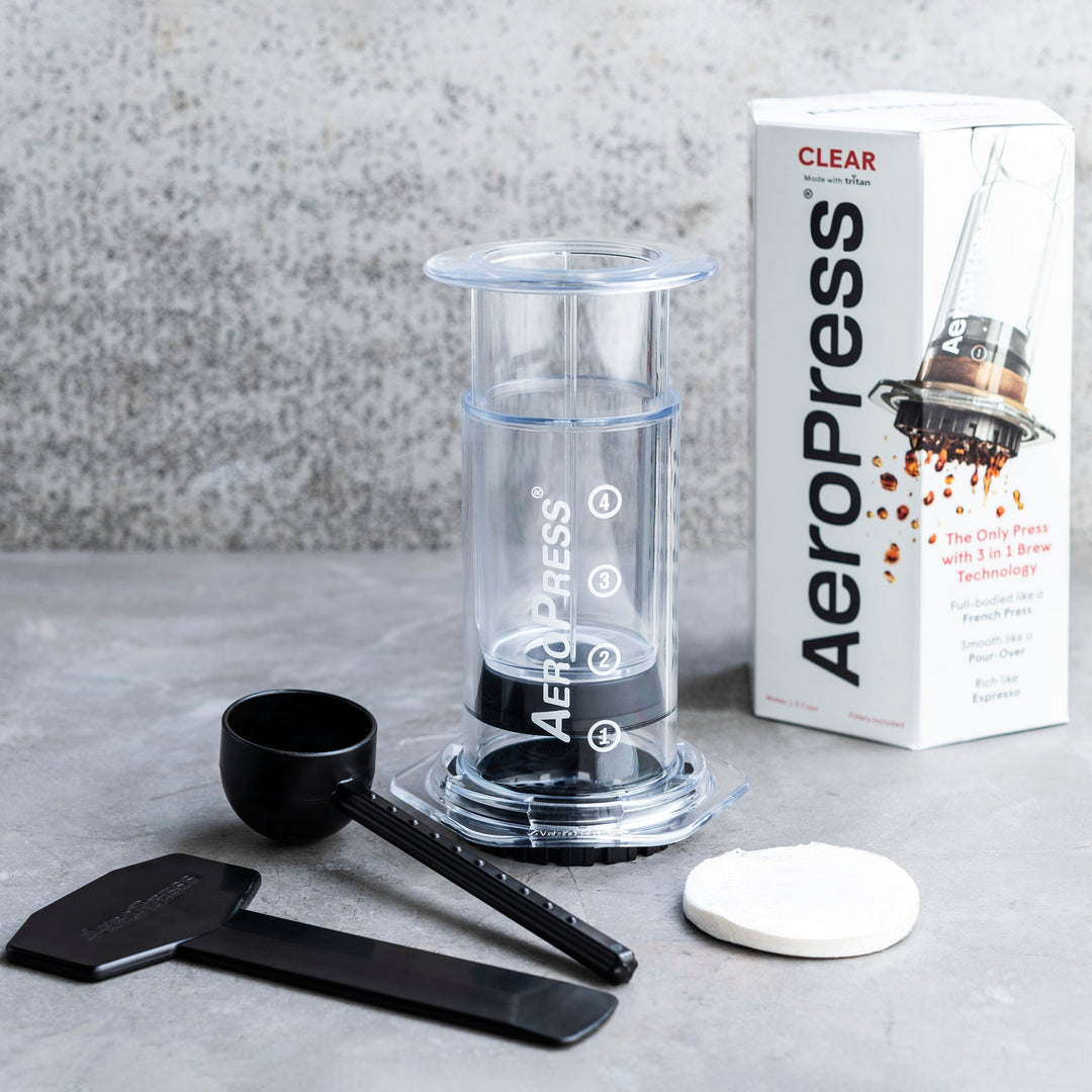 Comandante AeroPress Clear coffee grinder with transparent body and sleek design for precise coffee brewing.