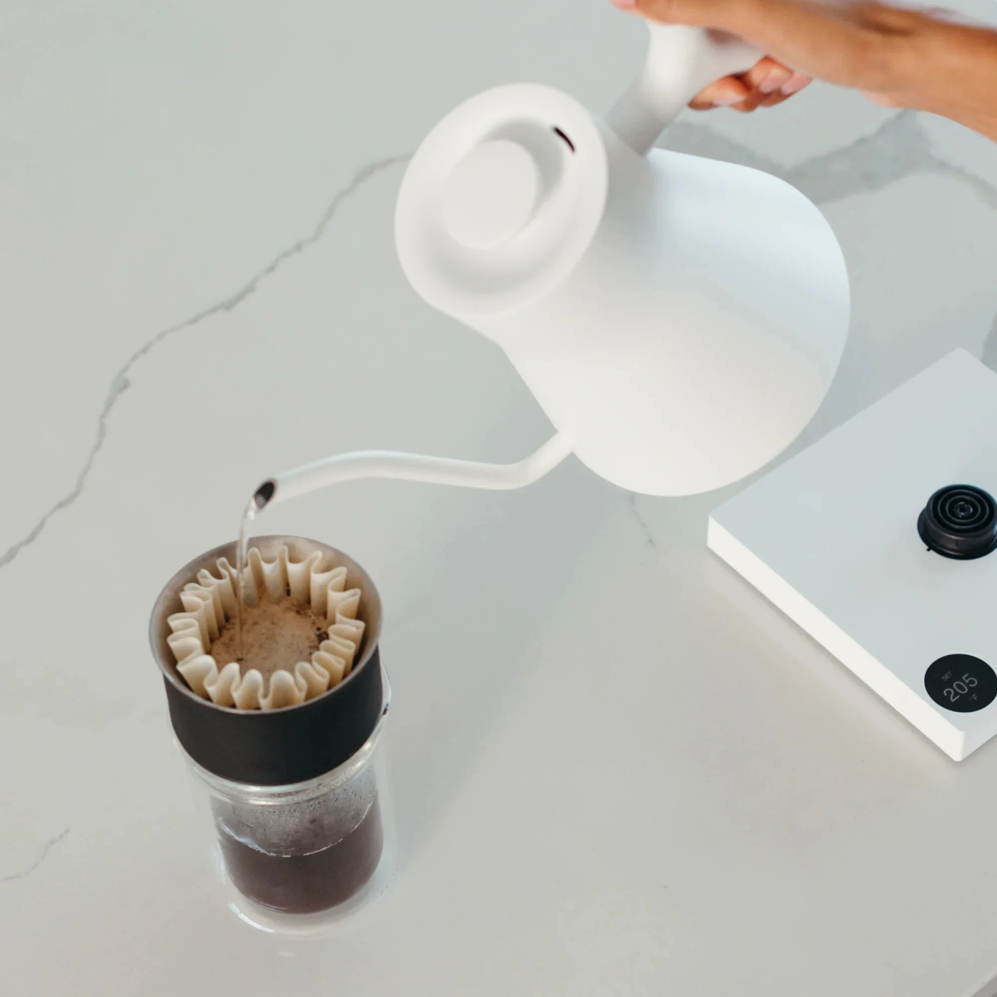 Fellow Stagg Matte Kettle with sleek design, white finish, and ergonomic handle for precise pour-over coffee brewing.