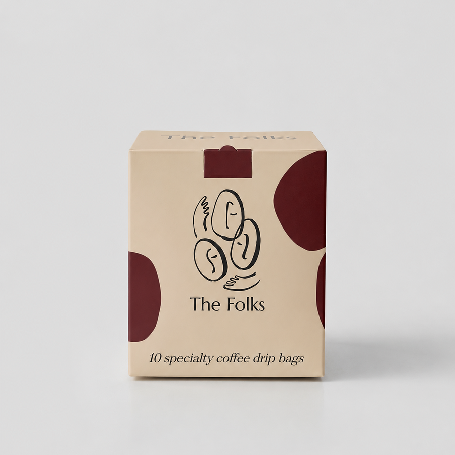 A box of 10 drip coffee beans from The Folks, showing the packaging with fresh coffee beans inside.