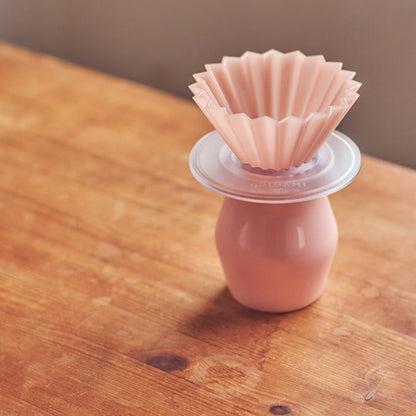 Clear Comandante coffee grinder holder designed for Origami coffee grinder, showcasing a sleek, transparent accessory for storage.