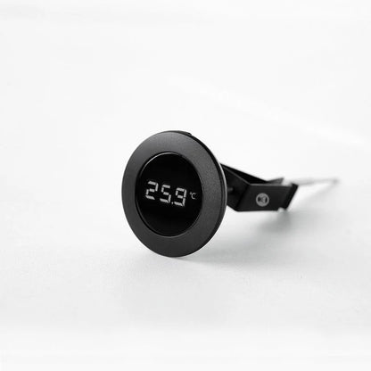 Comandante coffee grinder with Timemore digital thermometer attached, showing detailed grind settings and temperature display.