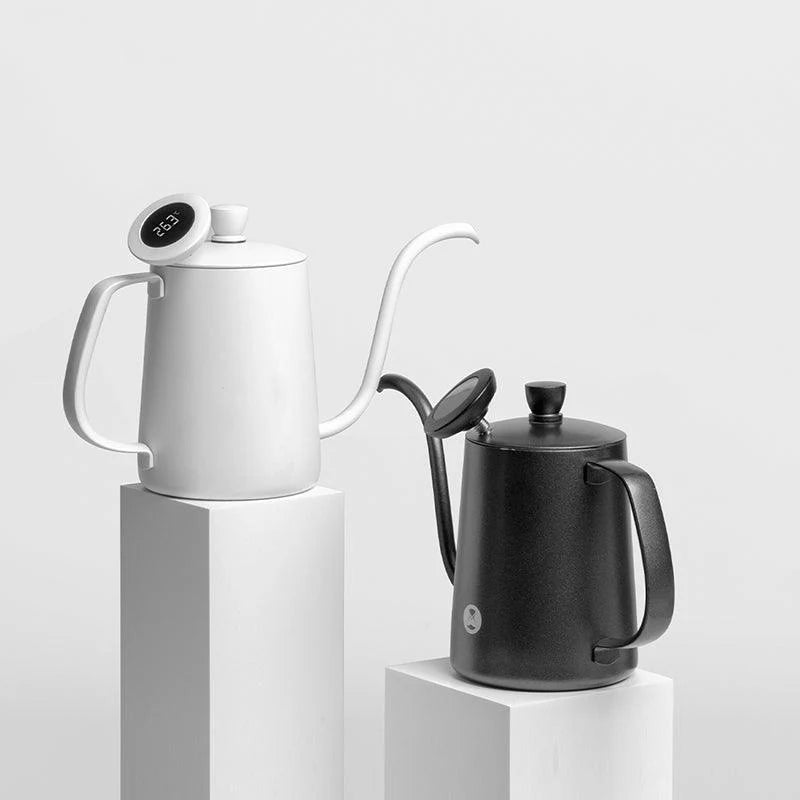 Comandante coffee grinder with Timemore digital thermometer attached, showing detailed grinder and temperature display.