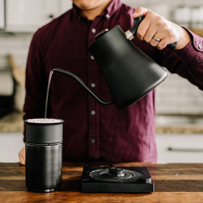Fellow Stagg Kettle in matte white, a sleek pour-over kettle with a curved spout and ergonomic handle for precise pouring.