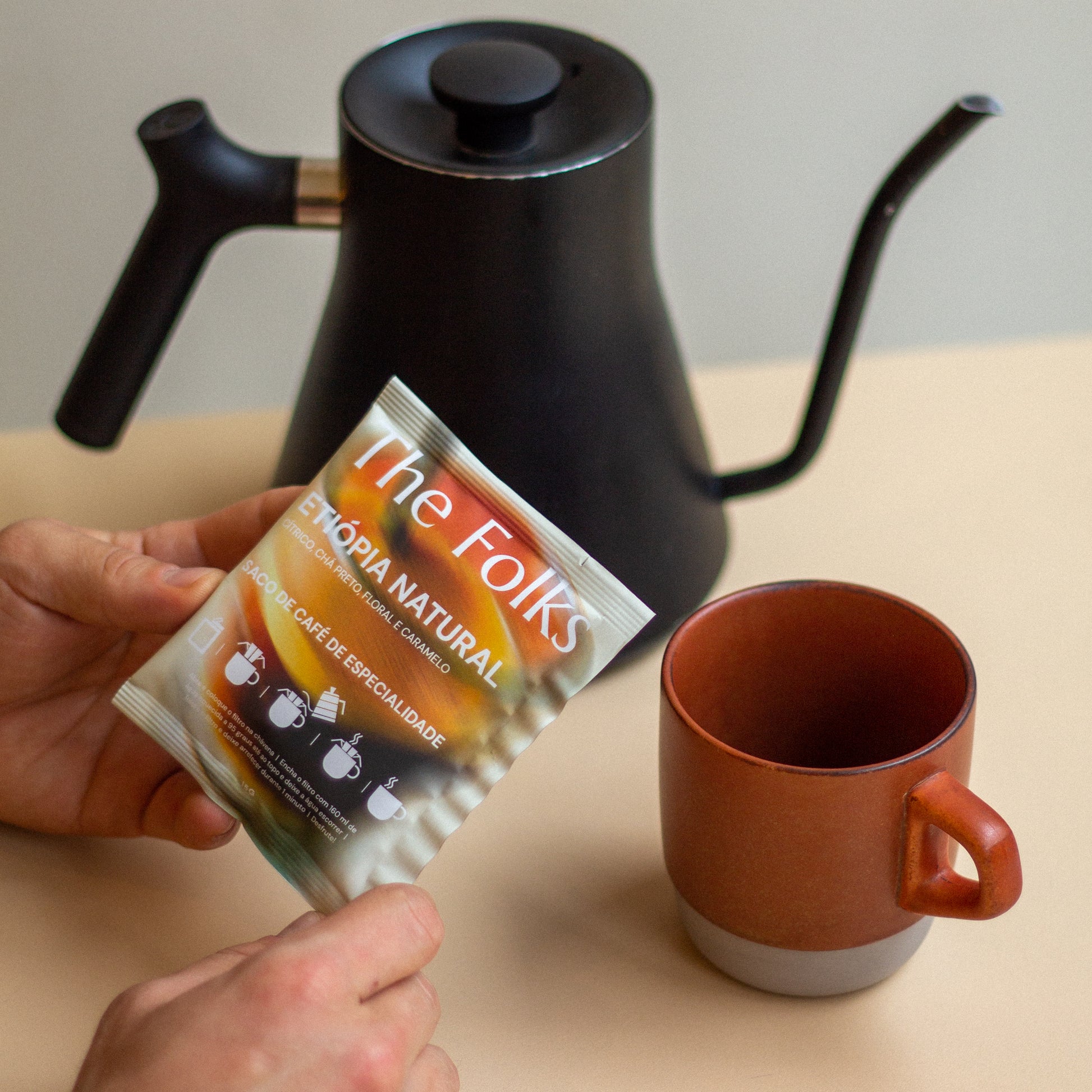 The Folks Colombia drip coffee beans with Flor de Azafrán label, showcasing a pack of fresh coffee beans for brewing.