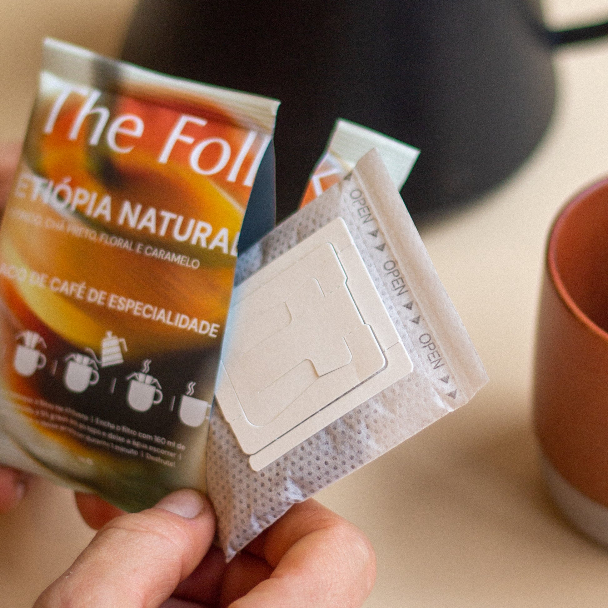 Pack of The Folks Colombia drip coffee beans with Flor de Azafrán label, showcasing fresh roasted coffee beans.