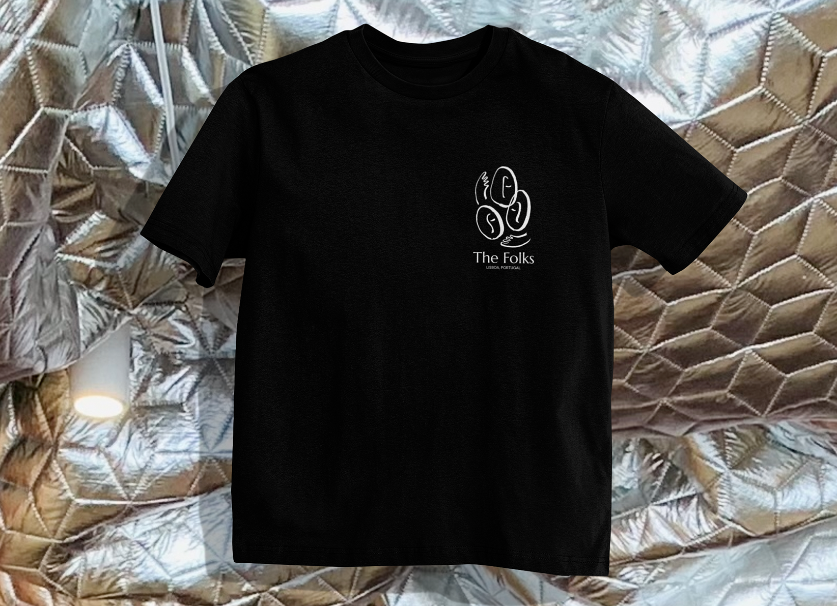 Heavyweight The Folks T-shirt in black, featuring a classic crew neck and durable cotton fabric, shown flat.
