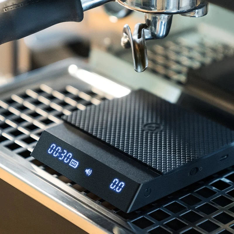 Timemore Black Mirror Nano coffee scale with timer and sleek black design, used for precise coffee brewing.