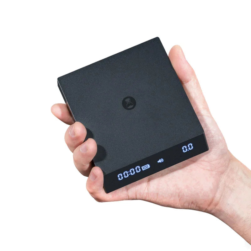 Timemore Black Mirror Nano coffee scale with timer, used for precise coffee brewing and measurement.